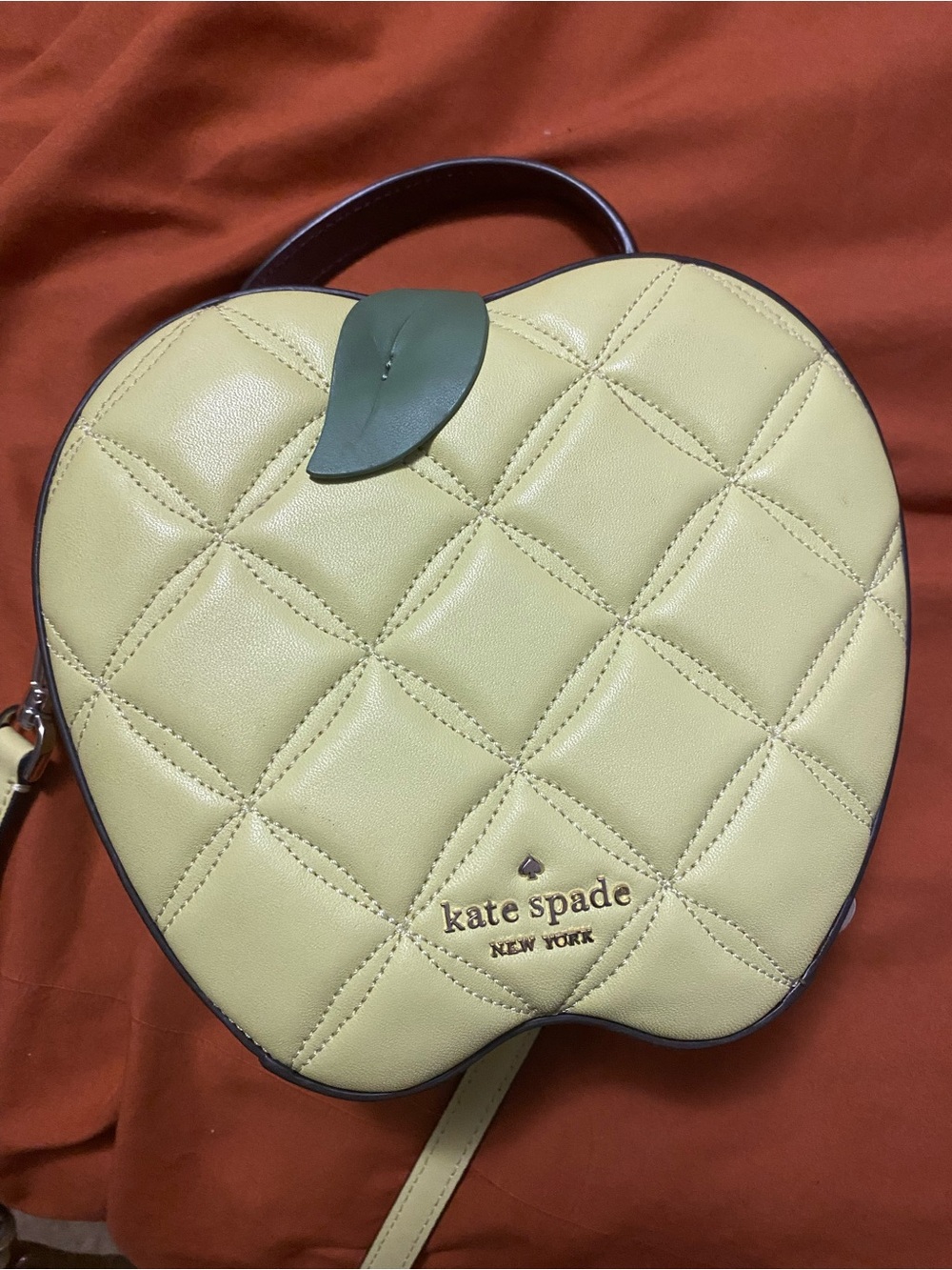 kate spade Pale Yellow Quilted Apple Crossbody with Green Leaf